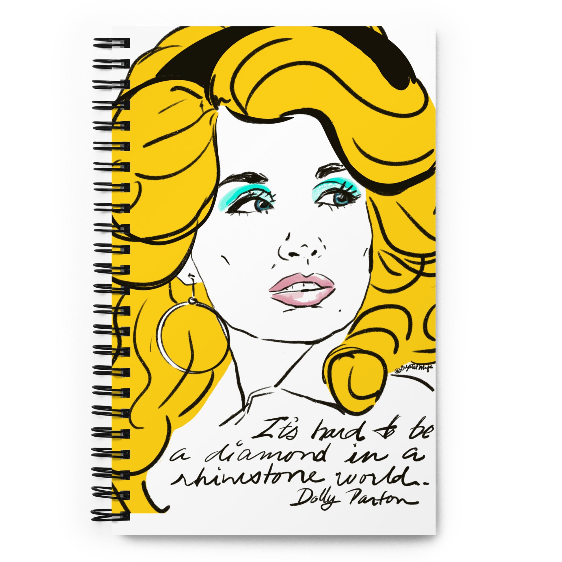 Spiral notebook with Dolly portrait in bold pop‑art style, featuring her signature blonde hair and blue makeup with the rhinestone‑world quote